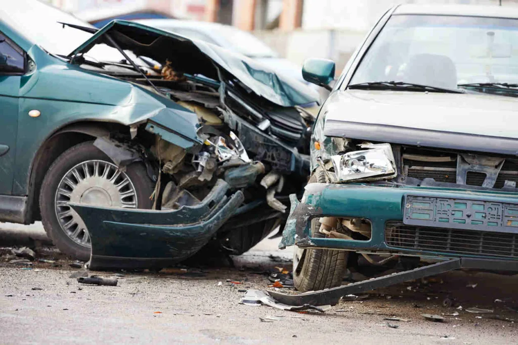 Severe front-end collision between two cars at an intersection causing major vehicle damage, illustrating intersection accident injury cases and personal injury claims.