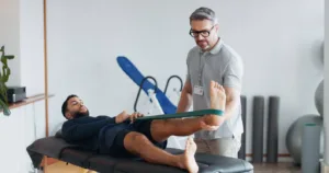 Physical therapy session with a patient after a Texas personal injury accident, highlighting the importance of consulting doctors for recovery and treatment.